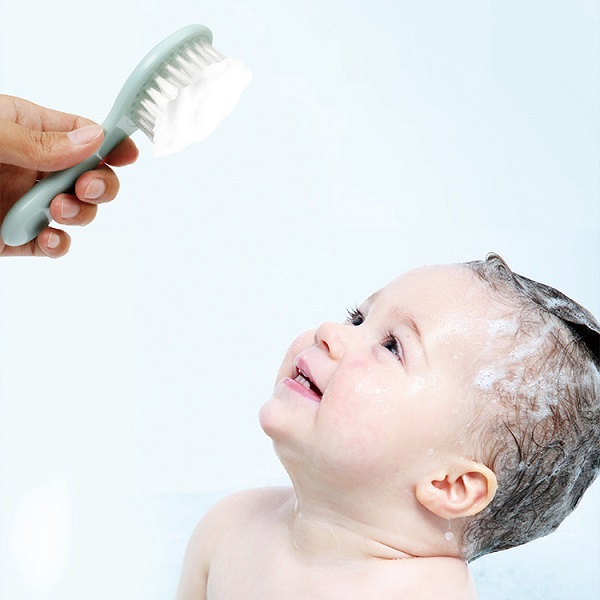 The Gentle Art of Washing Baby's Hair with a Soft Brush